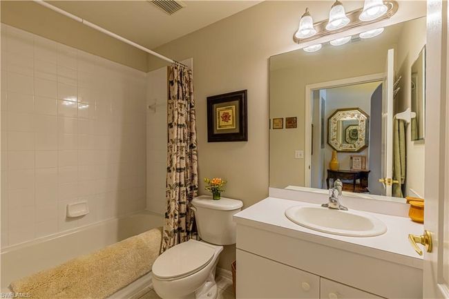 Full bathroom with vanity, toilet, and shower / tub combo with curtain | Image 18