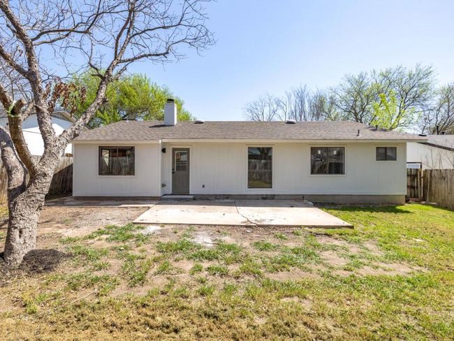 Back of house featuring a patio, a yard, fence, and a chimney | Image 25