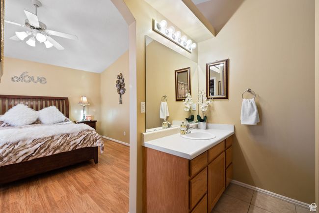 Interior space featuring sink, light tile patterned floors, and vaulted ceiling | Image 20