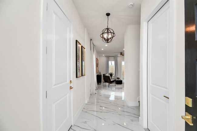 As you enter you will be in awe with all the luxurious finishes this home offers. Home has been thoughtfully designed by one of the top interior designers. | Image 5
