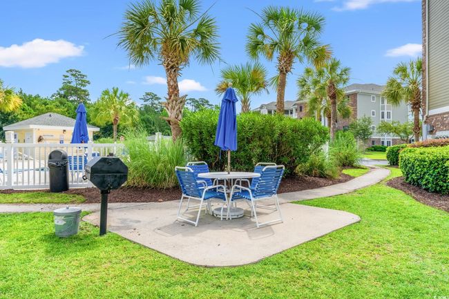 View of patio / terrace featuring area for grilling and outdoor dining area | Image 24