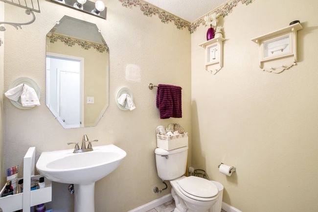 Half bath featuring toilet and baseboards | Image 14