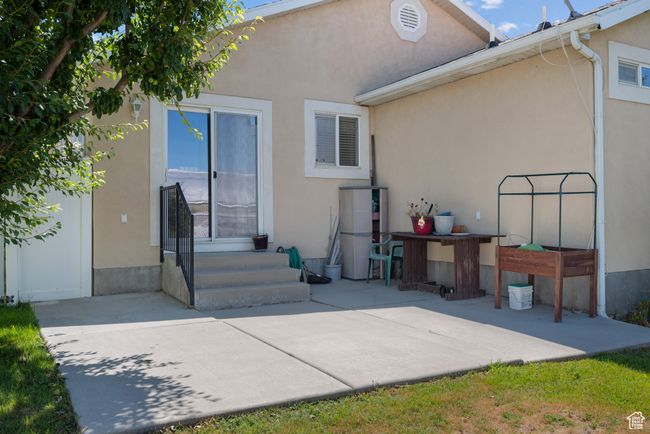 Back of house featuring stucco siding, a patio, and entry steps | Image 29