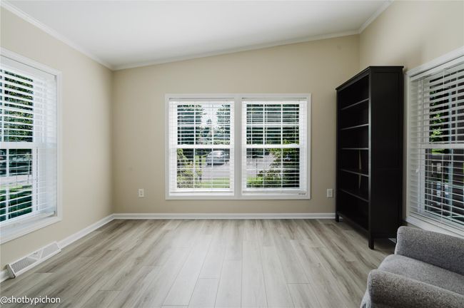Unfurnished room featuring light wood-style floors and ornamental molding | Image 6