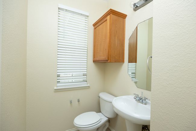 Half bath featuring a sink and toilet | Image 19