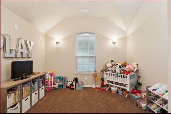 Recreation room featuring carpet flooring and lofted ceiling | Image 25