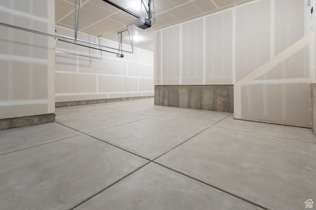 Garage featuring a garage door opener | Image 21