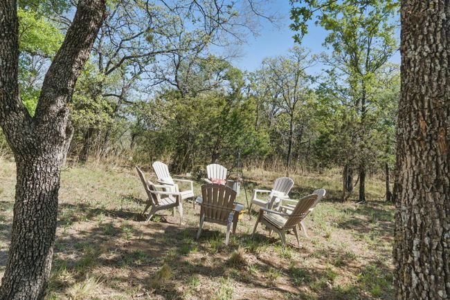 The wooded lot has room for gatherings and games. | Image 25
