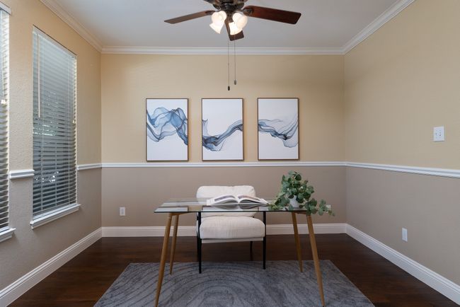 Office with wood finished floors, a ceiling fan, and ornamental molding | Image 7