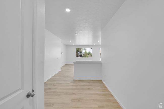 Unfurnished room featuring light wood-style flooring and recessed lighting | Image 11