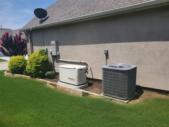 Exterior of home showing Generac generator | Image 29
