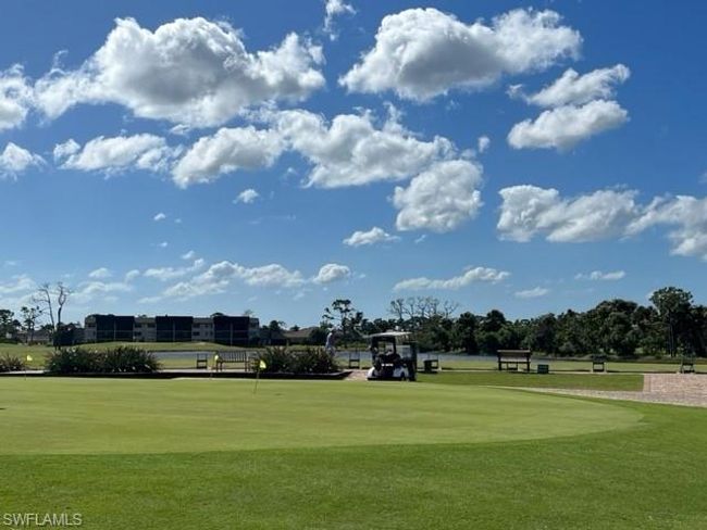View of home's community with a lawn | Image 44