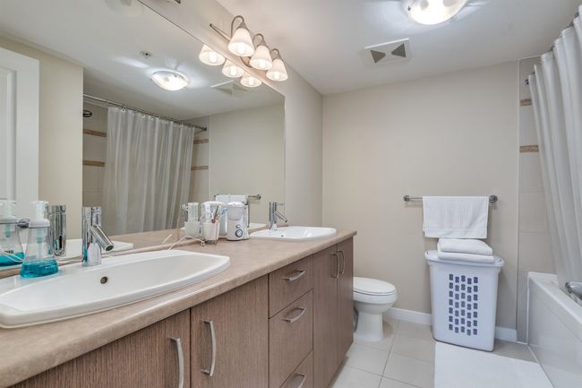 Full bath with tile patterned floors, a sink, toilet, and visible vents | Image 20