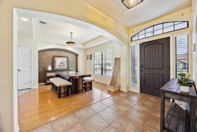 Then entrance to the home comes in to the entry way with the dining room to the right and the office/study to the left. | Image 9