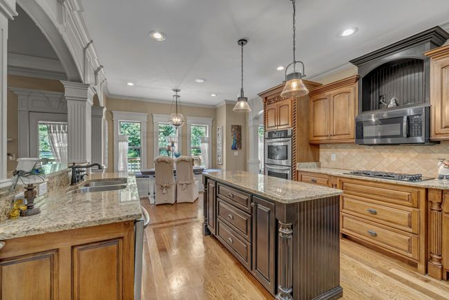 Gas Built-in range, custom island, and counter space galore! | Image 19