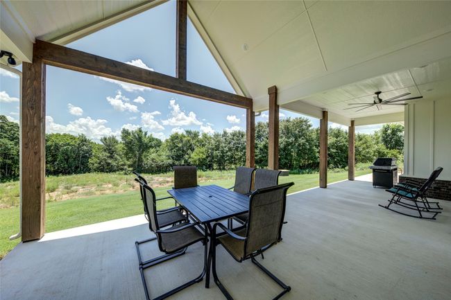 View of terrace featuring ceiling fan and grilling area | Image 29