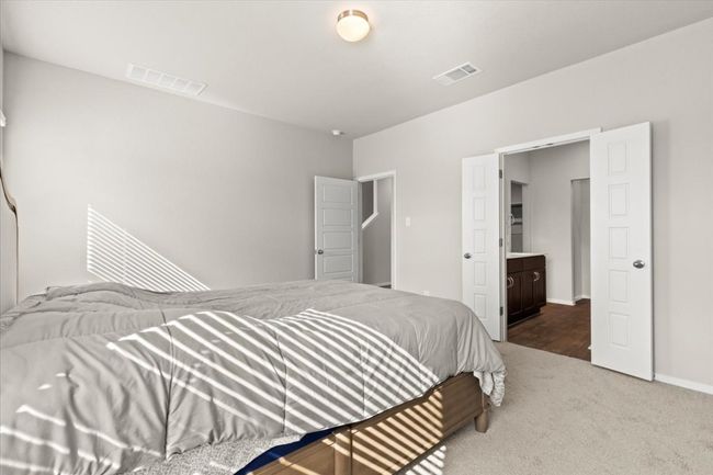 Carpeted bedroom with baseboards | Image 17