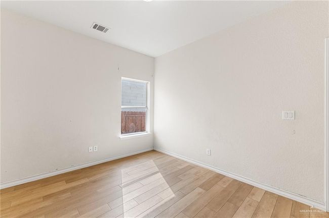 Empty room featuring light wood finished floors and baseboards | Image 29