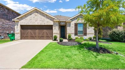 View of front of property with a garage and a front lawn | Image 1