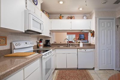 kitchen 2 overlooks the dining and living rooms | Image 3