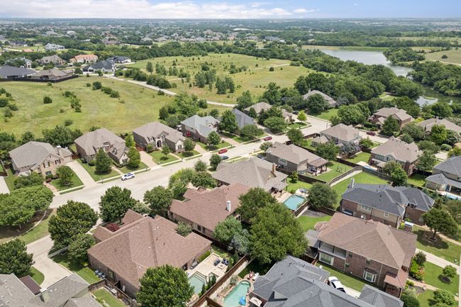 Aerial view of residential area with a large body of water | Image 39