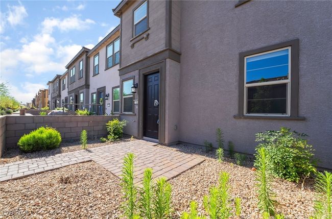 Property entrance featuring stucco siding and a residential view | Image 4