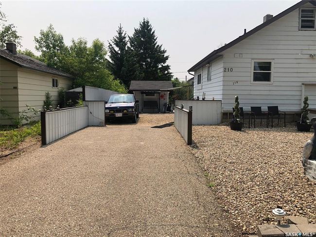 View of side of home featuring asphalt driveway | Image 5