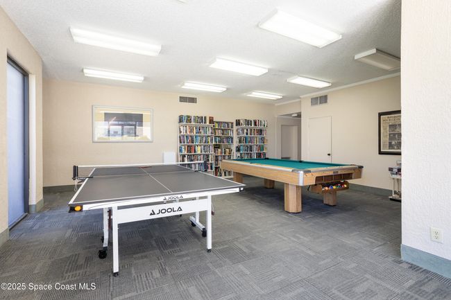 ping pong and pool table with a library. | Image 43