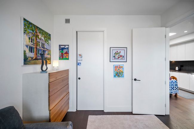 Bedroom featuring dark wood-style flooring and recessed lighting | Image 18