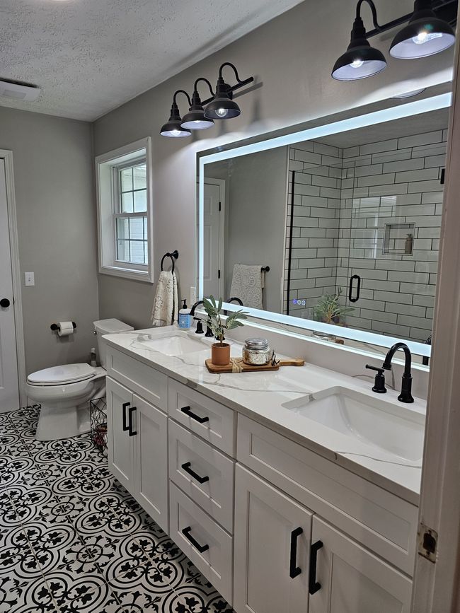 Double bowl vanities so no sharing. Touch lighted mirror just tops off this set up. | Image 23