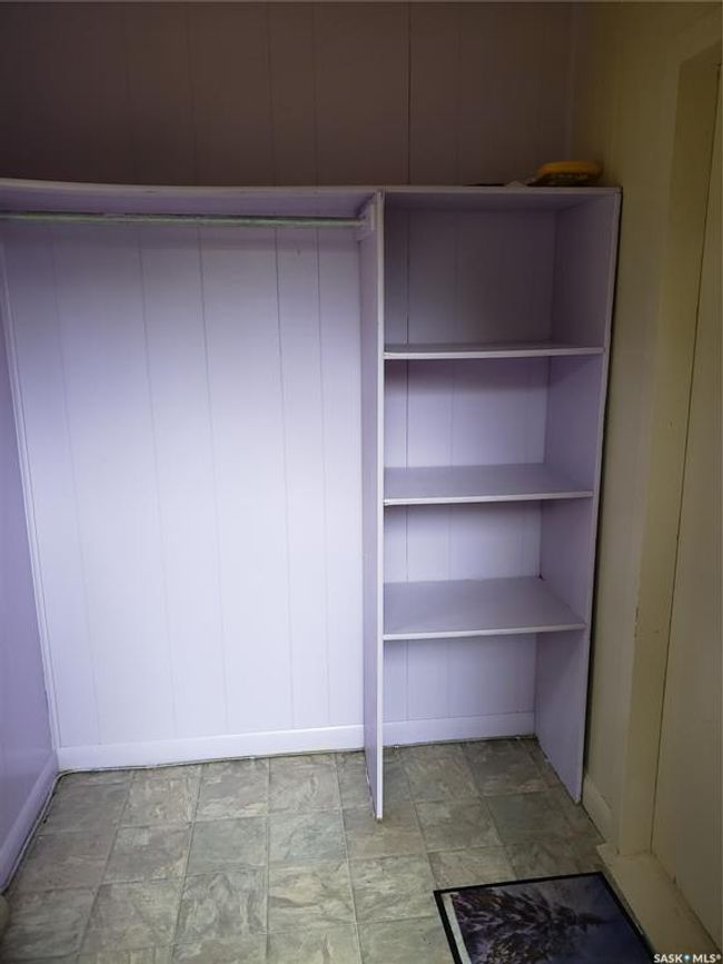 Front porch features storage and is heated. | Image 22