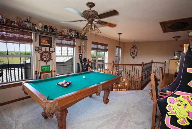 Game room with carpet, a ceiling fan, and pool table | Image 14