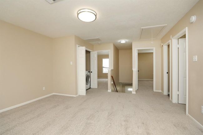 Game room with upstairs laundry center for convenience. | Image 20