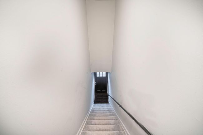 Staircase with carpet flooring and baseboards | Image 21