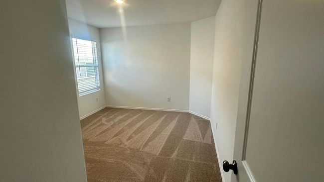 Empty room with carpet flooring and baseboards | Image 33
