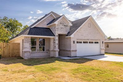 View of front of home featuring a garage and a front lawn | Image 3