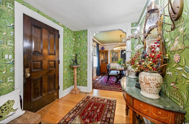Foyer entrance with light wood-style flooring, a chandelier, and wallpapered walls | Image 34