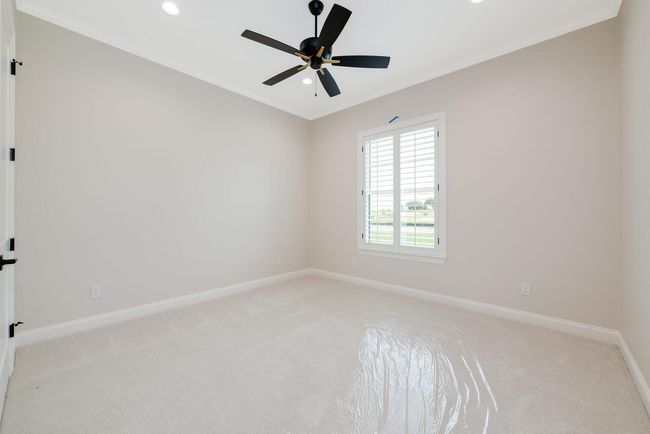 Unfurnished room with light colored carpet, recessed lighting, ceiling fan, and ornamental molding | Image 32
