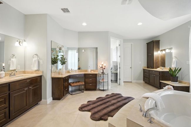 Full bath featuring two vanities, a bath, tile patterned floors, and recessed lighting | Image 20