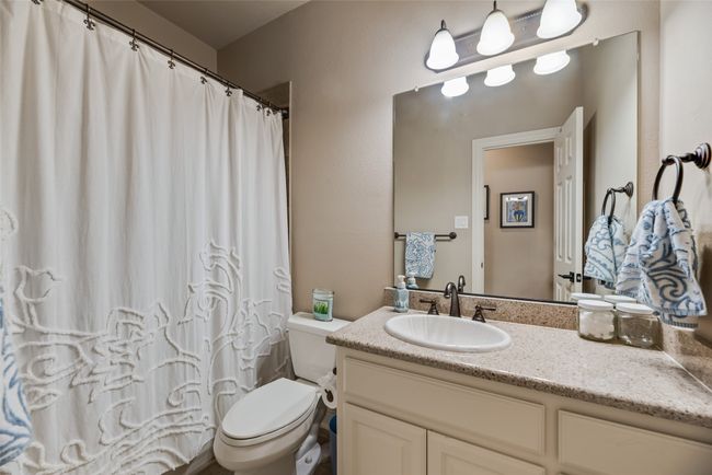 Full bath with vanity and curtained shower | Image 20