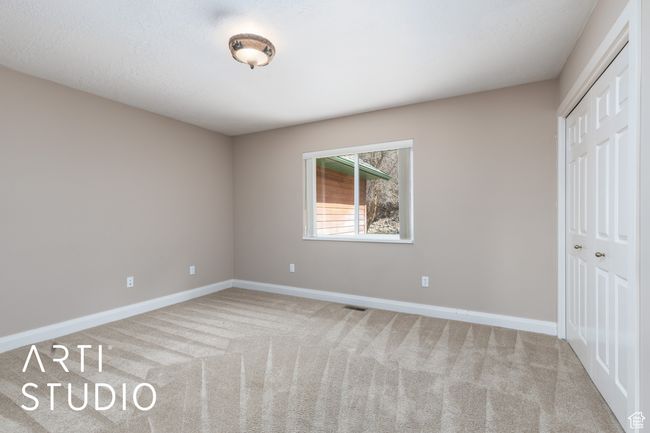 Unfurnished bedroom featuring visible vents, a closet, baseboards, and carpet floors | Image 31
