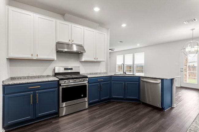 kitchen overlooking living room and dining area | Image 12