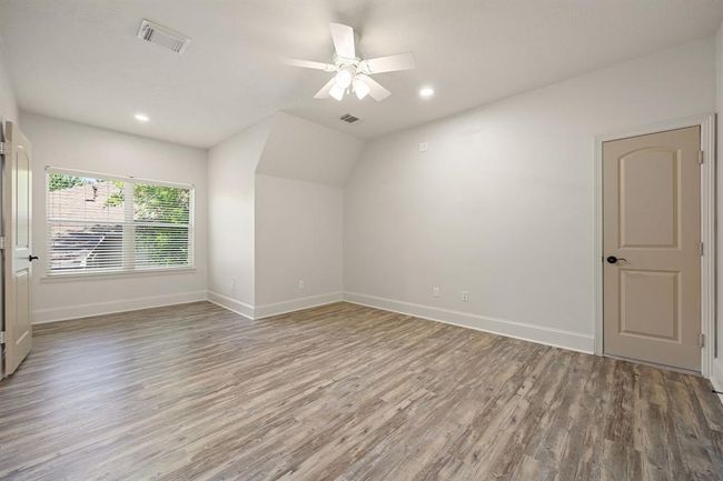 Secondary bedroom with large walk-in closet and access to upstairs attic. | Image 40