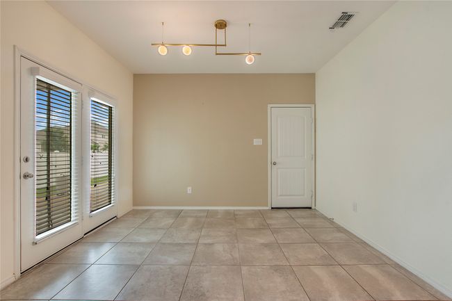 Empty room featuring light tile patterned floors | Image 18