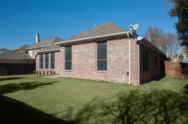 Back of property featuring roof with shingles and brick siding | Image 19