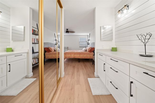Primary dressing area leading into walk-in closet and bathroom | Image 13