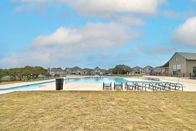 Community pool with a yard and a residential view | Image 37