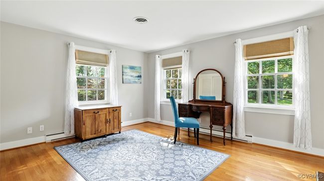 Office space with light wood-style floors and a baseboard radiator | Image 21