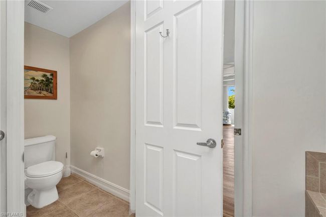 Bathroom with baseboards and tile patterned floors | Image 24