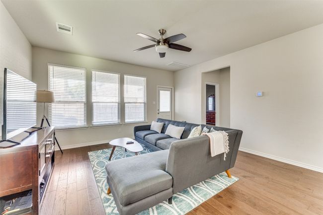 From the kitchen, one can enjoy the open floor-plan and easily chat with the family | Image 4